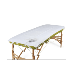 Balts elektriskais sildošais paklājs masāžas galdam ar vadības pulti.